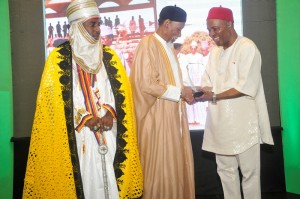 Professor Galadanci receiving his award from HE Dr.  Ogbonnaya Onu while the representative Emir of Kano watches on
